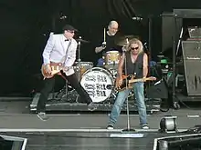 Nielsen, Carlos and Zander, of the band Cheap Trick, on tour with Def Leppard and Poison in 2009 at the Sleep Train Amphitheater in Marysville, CA