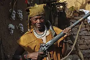 Image 8A Dogon hunter with an old flintlock rifle still in use. (from Culture of Mali)