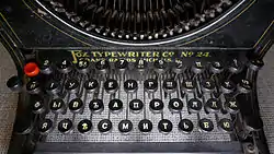 1912 typewriter with Russian layout. № sign can be seen on the .mw-parser-output .keyboard-key{border:1px solid #aaa;border-radius:0.2em;box-shadow:0.1em 0.1em 0.2em rgba(0,0,0,0.1);background-color:#f9f9f9;background-image:linear-gradient(to bottom,#eee,#f9f9f9,#eee);color:#000;padding:0.1em 0.3em;font-family:inherit;font-size:0.85em}8 key.