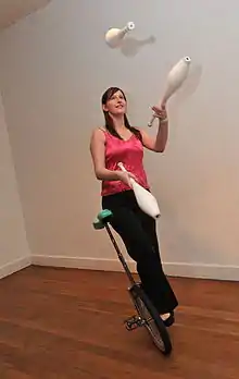 Kaleigh Grainger performing her signature trick: Juggling 3 Clubs in Crank Idle